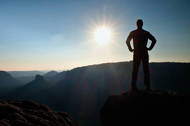 istock Man has his hands on  hips. Sportsman  silhouette in daybreak. 500746168