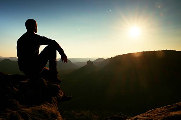 istock Hiker take relaxing enjoying sunset at horizon. Vivid effect. 500746320