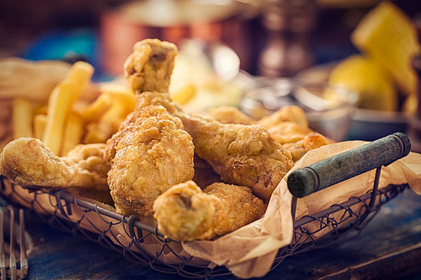Homemade Golden Fried Chicken Homemade golden fried chicken legs served in a basket. Super crunchy and ready to eat. crunchy stock pictures, royalty-free photos & images