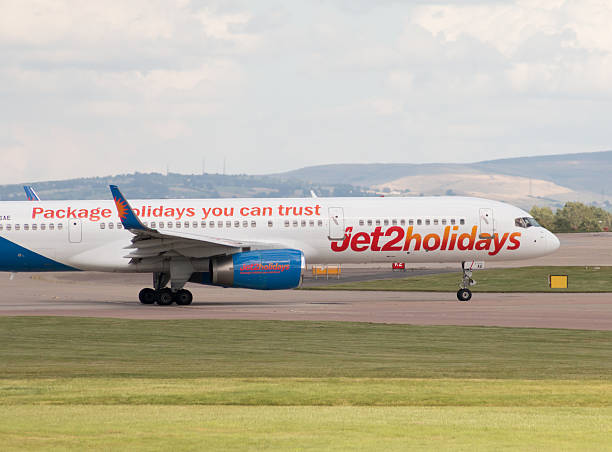 Jet2Holidays Boeing 757 Manchester, United Kingdom - August 27, 2015: Jet2Holidays Boeing 757 narrow-body passenger plane (G-LSAE) taxiing on Manchester International Airport tarmac. boeing 757 stock pictures, royalty-free photos & images