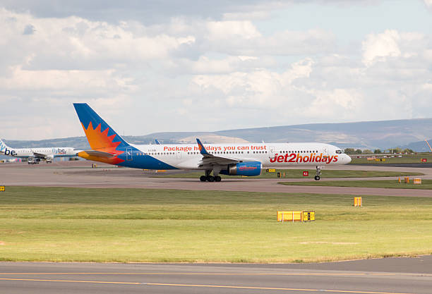 Jet2Holidays Boeing 757 Manchester, United Kingdom - August 27, 2015: Jet2Holidays Boeing 757 narrow-body passenger plane (G-LSAE) taxiing on Manchester International Airport tarmac. boeing 757 stock pictures, royalty-free photos & images