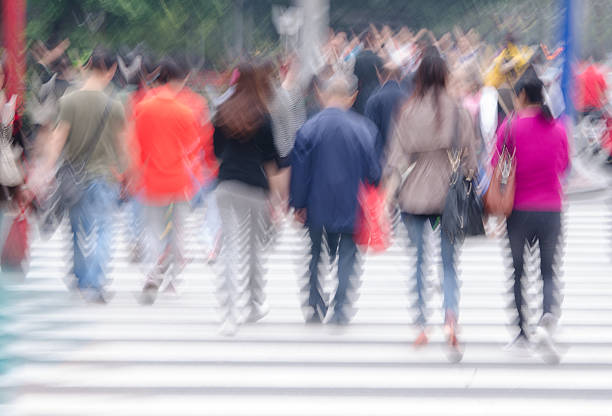 istock People across the zebra crossing 500750087