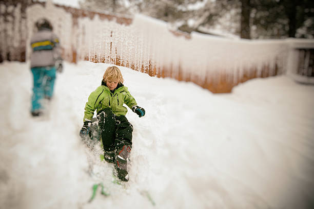 istock Boy and girl sledding 500751000