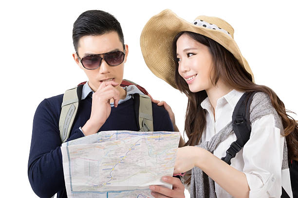 istock Asian young couple traveling and looking the map 500751339