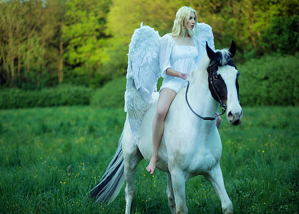istock Bare feet angel riding a horse 500751907