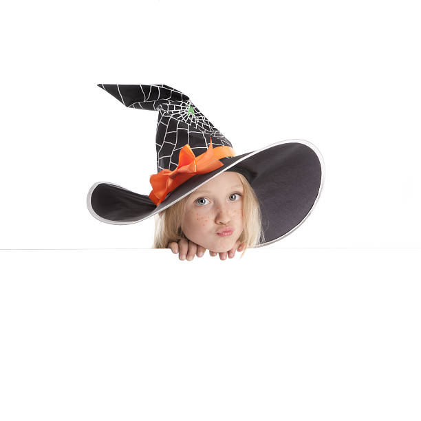 istock Little Funny Witch Holding a Sign . 500751939