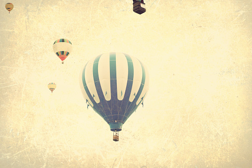 Vintage colorful hot air balloons in flight