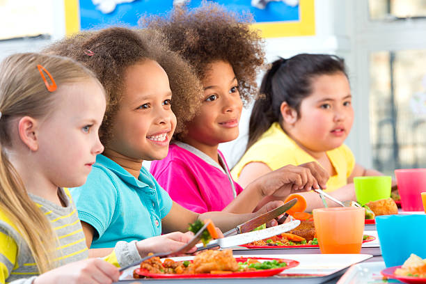 istock Children Eating School Dinners 500753939