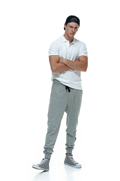 istock Young man standing with arms crossed 500754243