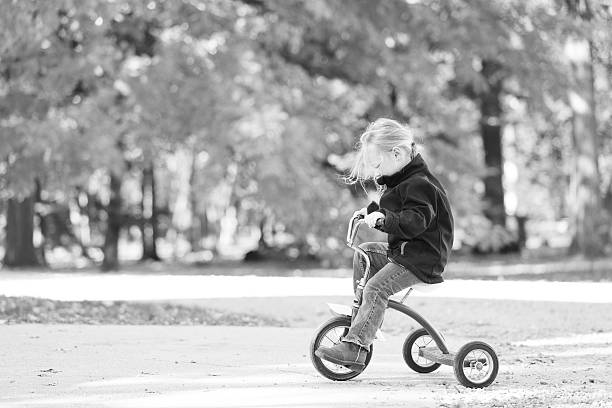 istock Little Girl Riding Tricycle 500754730