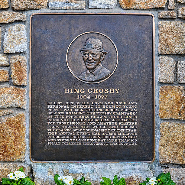 Bing Crosby Plaque, Pebble Beach, CA Pebble Beach, CA, USA - Dec. 5, 2015: Bing Crosby Plaque honors Bing Crosby - singer, actor, avid golf player - for helping the youth. Out of this concern was born the Bing Crosby Pro-Am Golf Tournament, popularly known as the "Crosby Clambake". Under Bing's supervision the Clambake has attracted top players from around the world and has become the classic golf tournament of the year, raising millions for youth centers, orphanages and college loan funds. bing crosby stock pictures, royalty-free photos & images