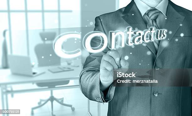 Businessman Pushing Contact Us Sign Stock Photo - Download Image Now - Abstract, Adult, Business