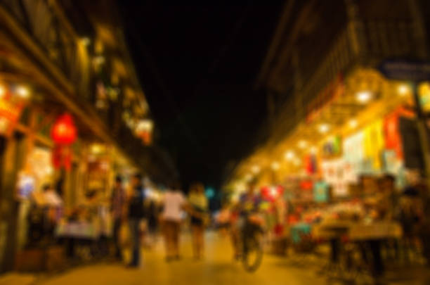 istock blurred image of people moving 500755260