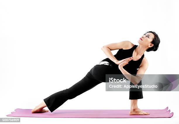 Young Beautiful Yoga Posing On A White Studio Background Stock Photo - Download Image Now