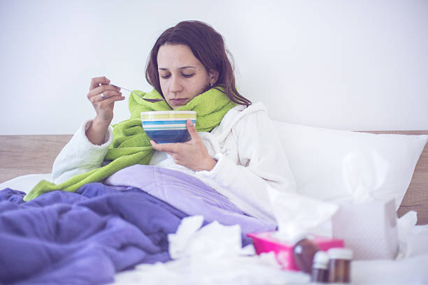 istock Eating chicken noodle soup in bed while sick 500756934