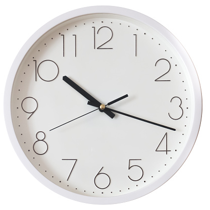 White wall clock isolated on white background. One hour of the day or night.