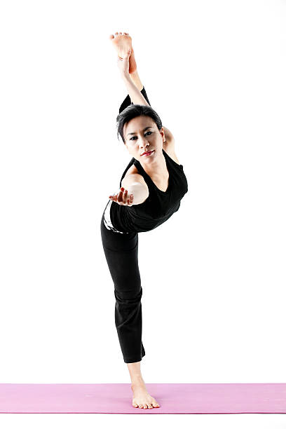 istock young beautiful yoga posing on a white studio background 500757141