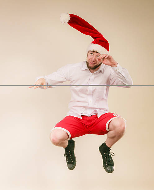 istock Active man in santa hat dancing and jumping. 500758790