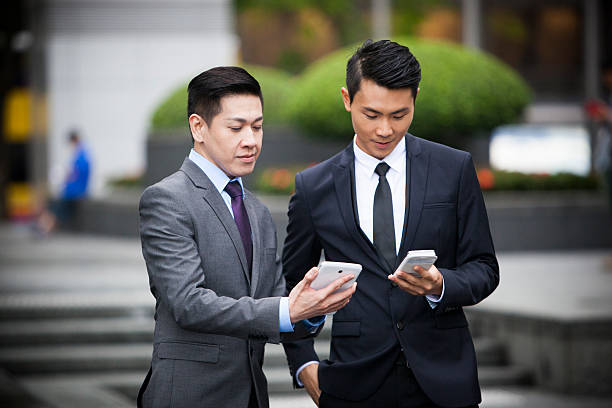 istock Businessmen with smartphones 500764127