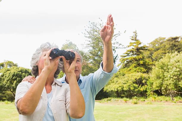 istock Man pointing to something for his wife holding binoculars 500766325