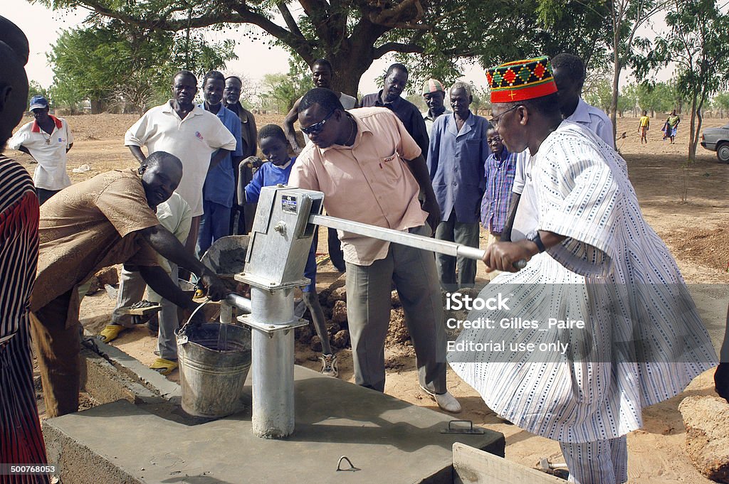 installation of a pump Koupela, Burkina Faso - february 23, 2007: installation and assembly of a pump in Burkina Faso funded humanitarian associassion. The village chief innaugure the new pump in the village. Africa Stock Photo