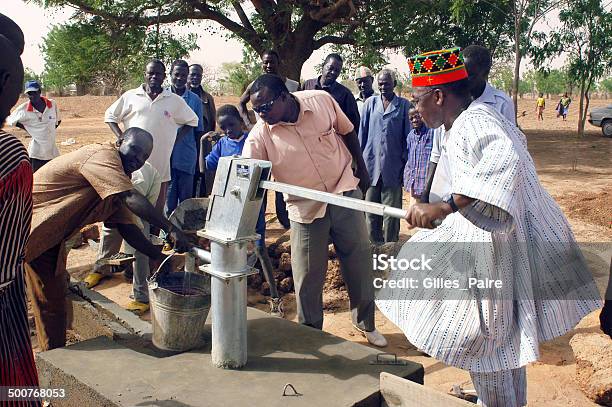 Installation Of A Pump Stock Photo - Download Image Now - Africa, Water Pump, African Ethnicity