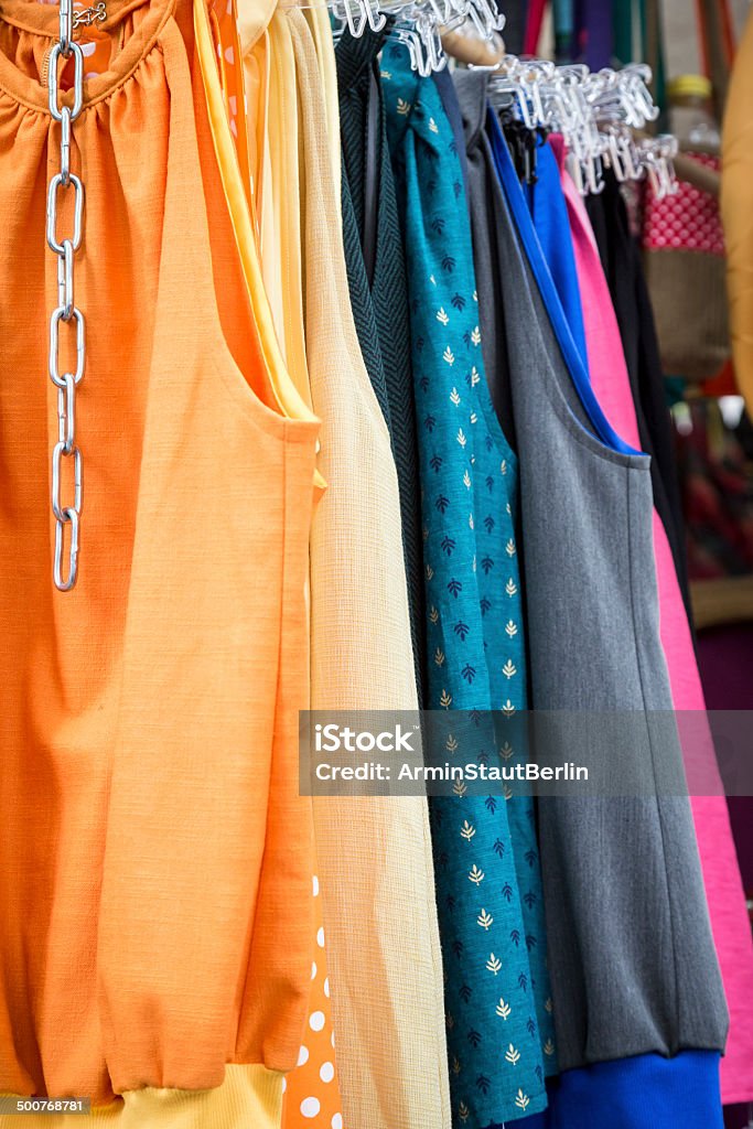 clothes on a rack on a flea market clothes on a rack on a flea market. Abundance Stock Photo