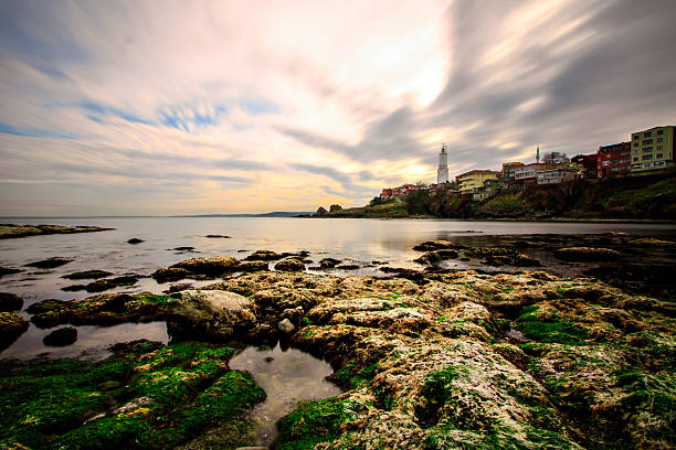 faro rumeli. - long exposure rock cloud sky foto e immagini stock