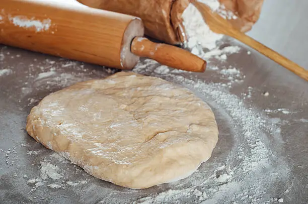 Man hands making yeast dough for estonian pastry kringel