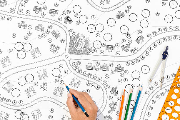 istock Landscape Architect Designs Blueprints For Resort. 500774736