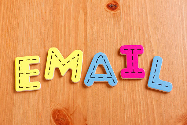 istock EMAIL, spell by woody puzzle letters with woody background 500774812