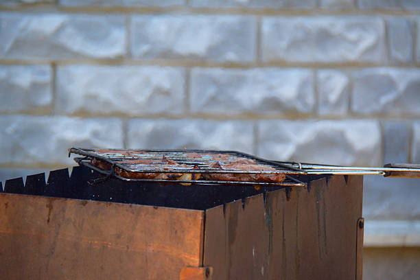 istock grill with steaks for the barbecue, side  view 500774904