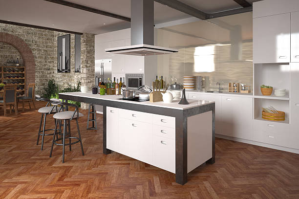 Modern luxury open-plan kitchen Modern luxury open-plan kitchen with a center island and built in appliances with white decor over a decorative herringbone parquet floor herringbone stock pictures, royalty-free photos & images