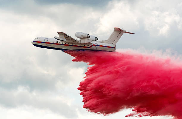 istock Flying aerial firefighting pour water 500780120