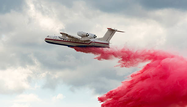 istock Flying aerial firefighting pour water 500780298