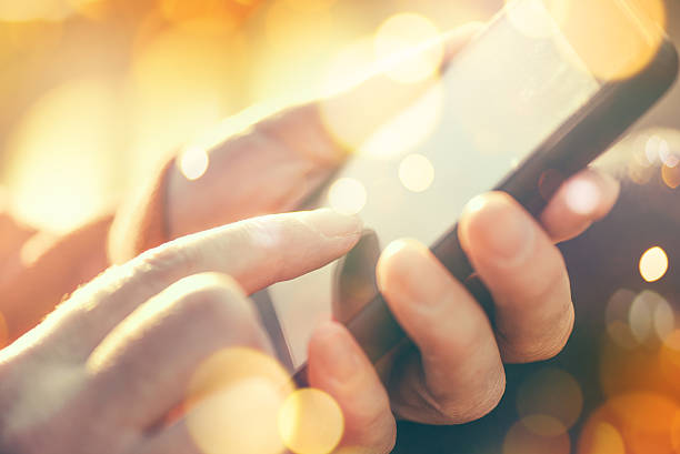 istock Female hands with mobile smartphone 500780944