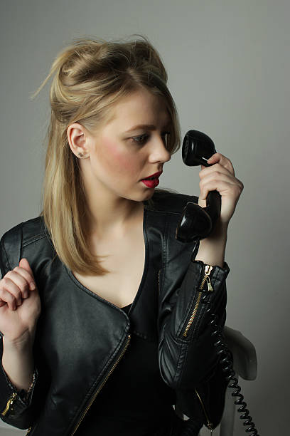 istock young cute blond girl with an old handset 500781970