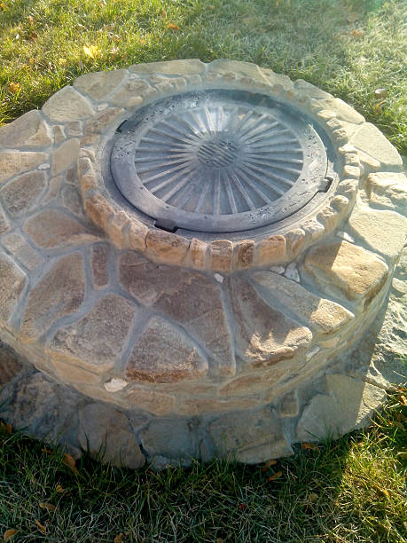 istock The manhole is protected with a natural stone. 500783354