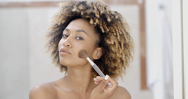 istock Young Woman Putting Make Up 500785634