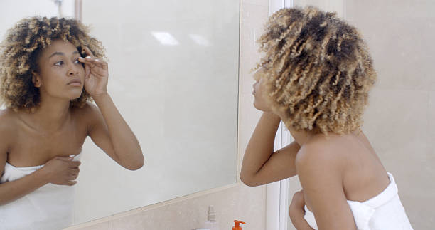 istock Happy Young Woman Looking On Mirror 500786040