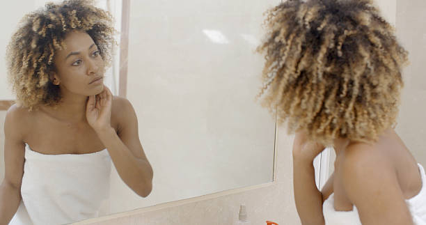 istock Happy Young Woman Looking On Mirror 500786094