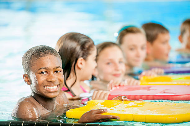 Group of Children in a Swimming Lesson