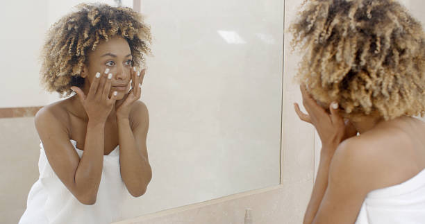 istock Woman Viewing Herself In The Mirror 500786136
