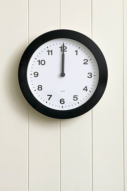 Clock on painted wood panel wall stock photo