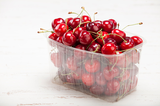 Cherry in plastic container.