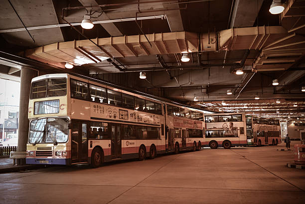 Hong Kong, China - August 8, 2013 : Bus station in Hong Kong. With a land mass of 1,104 km and a population of 7 million people, Hong Kong is one of the most populated areas in the world.