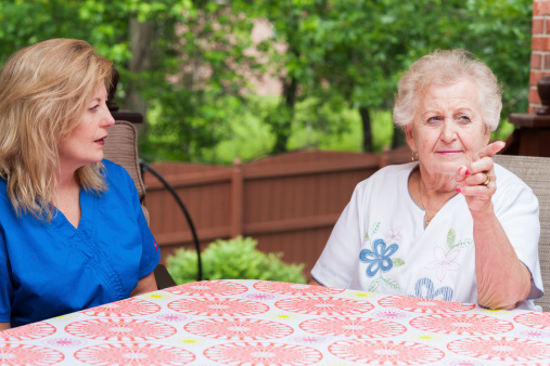 Stroke patient carries out one step directions during a home health speech therapy session  targeting auditory comprehension during aphasia rehabilitation