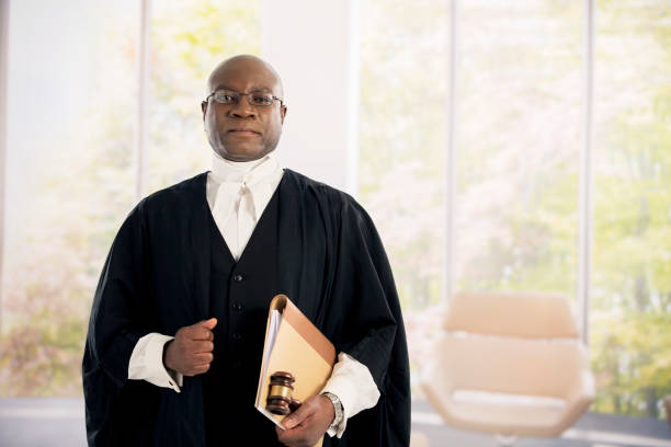 Technology and law career. Young male lawyer hold laptop portable computer help with work future.