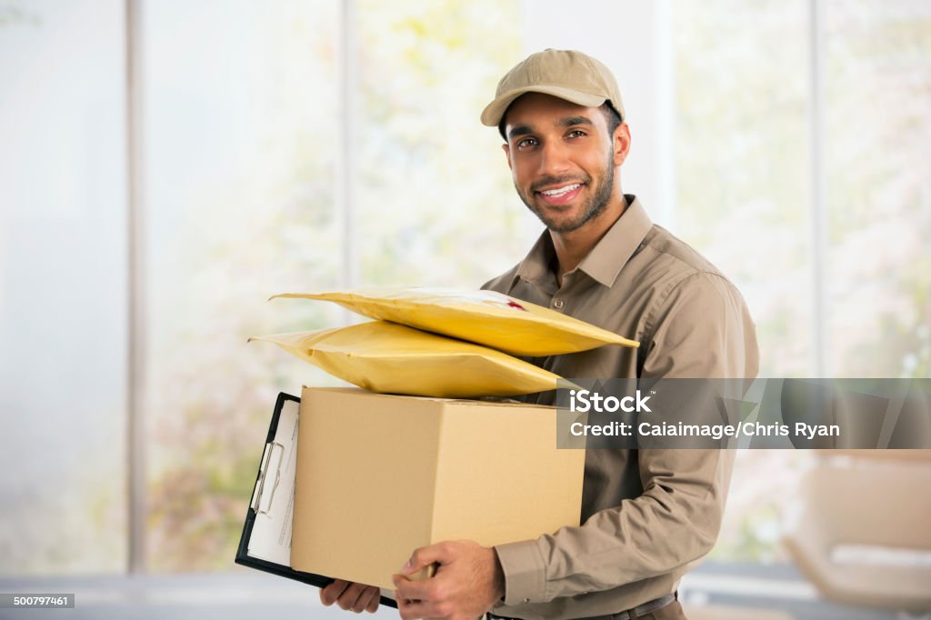 Portrait of confident deliveryman  Delivery Person Stock Photo