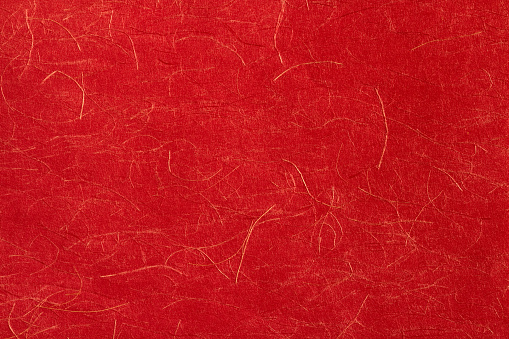 Papel rojo japonés con rosca de oro. photo